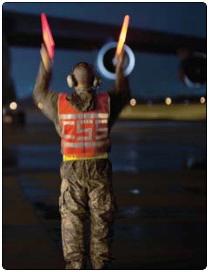 Figure 1-26. Night operations with wands.