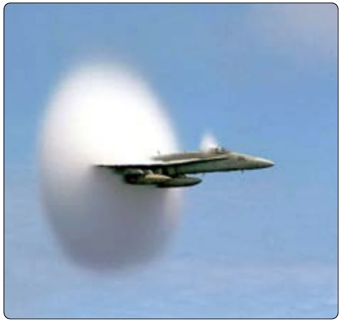 Figure 5-52. F-18 high-speed fly-by and a vapor cloud.