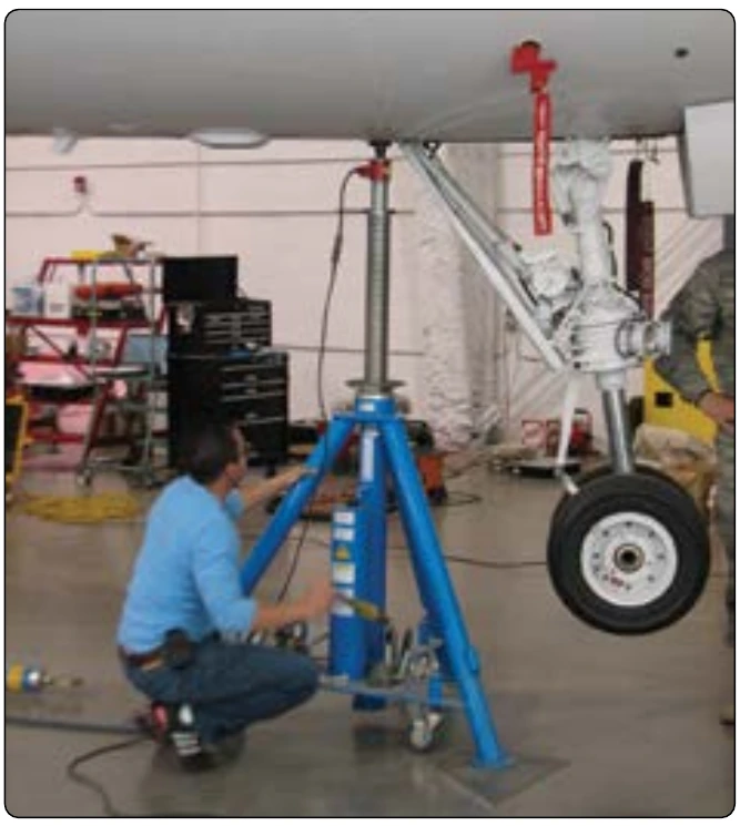 Figure 6-20. Airplane on jacks with load cells in use.