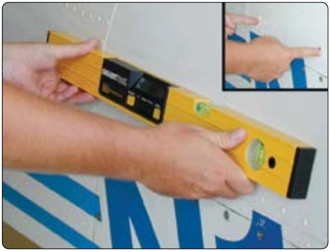 Figure 6-21. Spirit level being used on a Mooney M20.