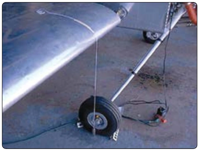 Figure 6-22. Plumb bob dropped from a wing leading edge.