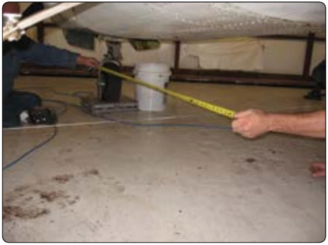 Figure 6-23. Measuring the nosewheel arm on an airplane.