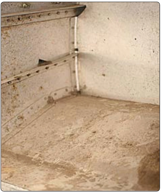 Figure 8-4. Direct chemical attack in a battery compartment.