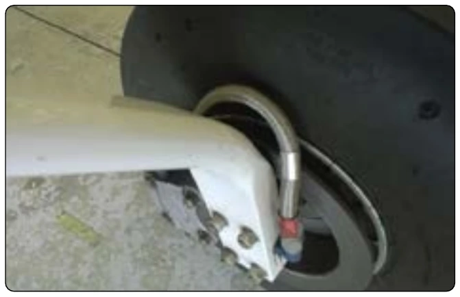 Figure 9-32. Flexible hose with stainless braid.
