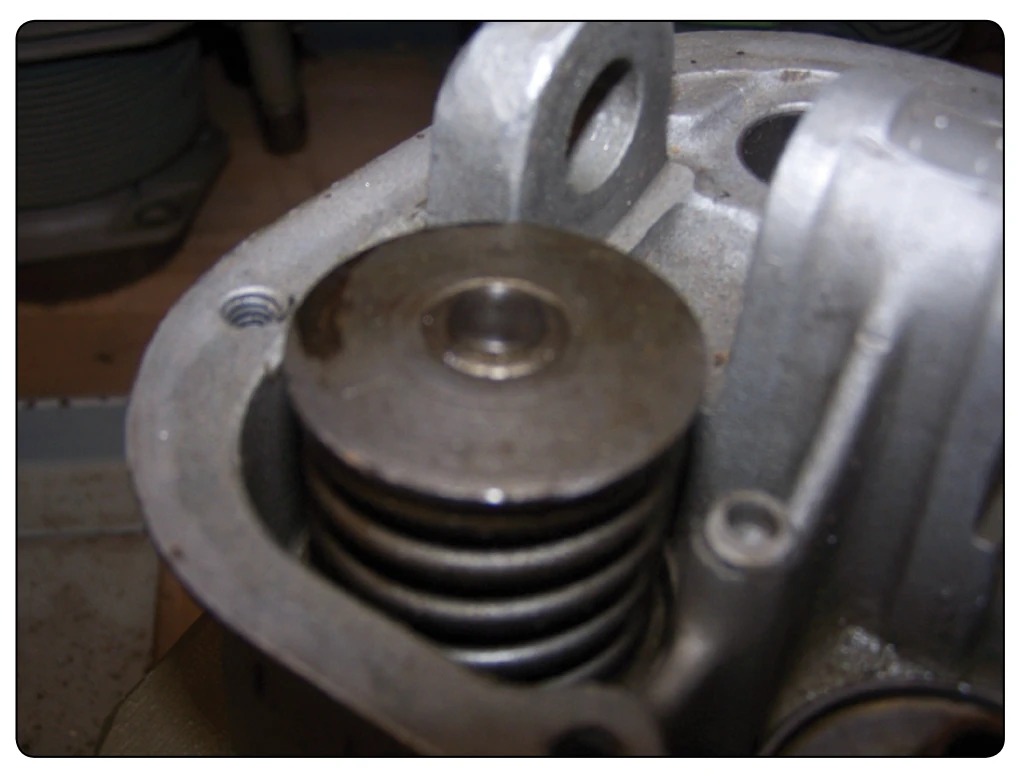 Stem keys forming a lock ring to hold valve spring retaining washers in place.
