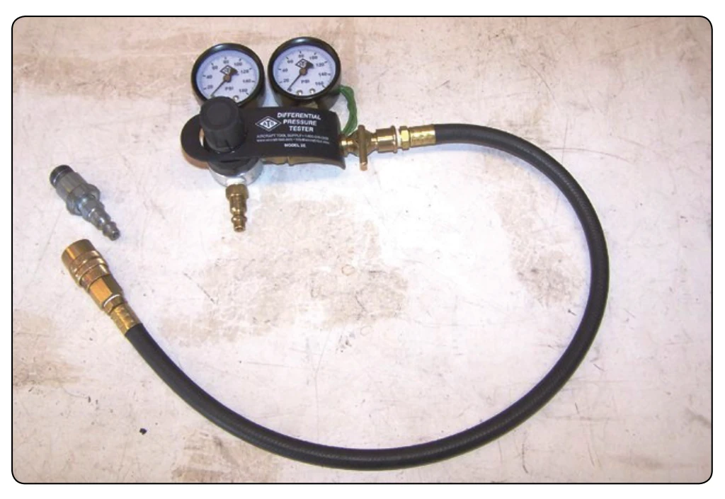 Compression tester and adapter.