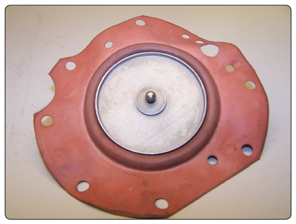 Fuel diaphragm with ball valve attached.