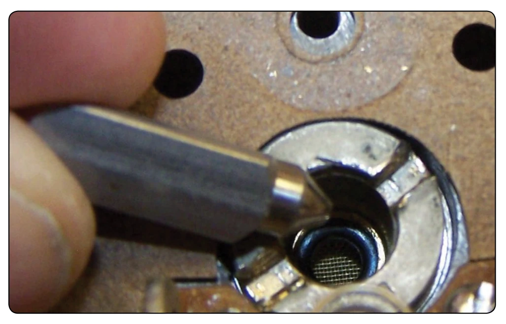 Needle valve and seat.