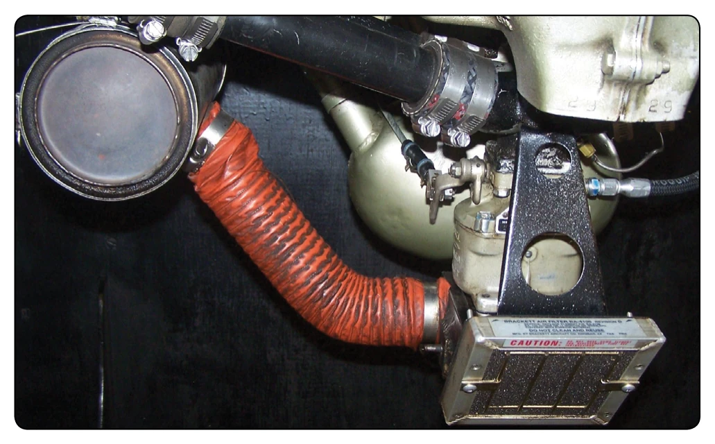 Location of a carburetor heat air valve.