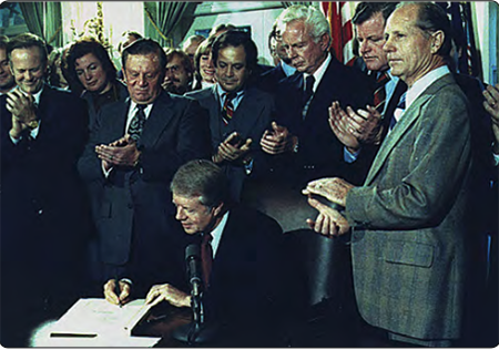 Figure 1-11. President Jimmy Carter signs the Airline Deregulation Act in late 1978.