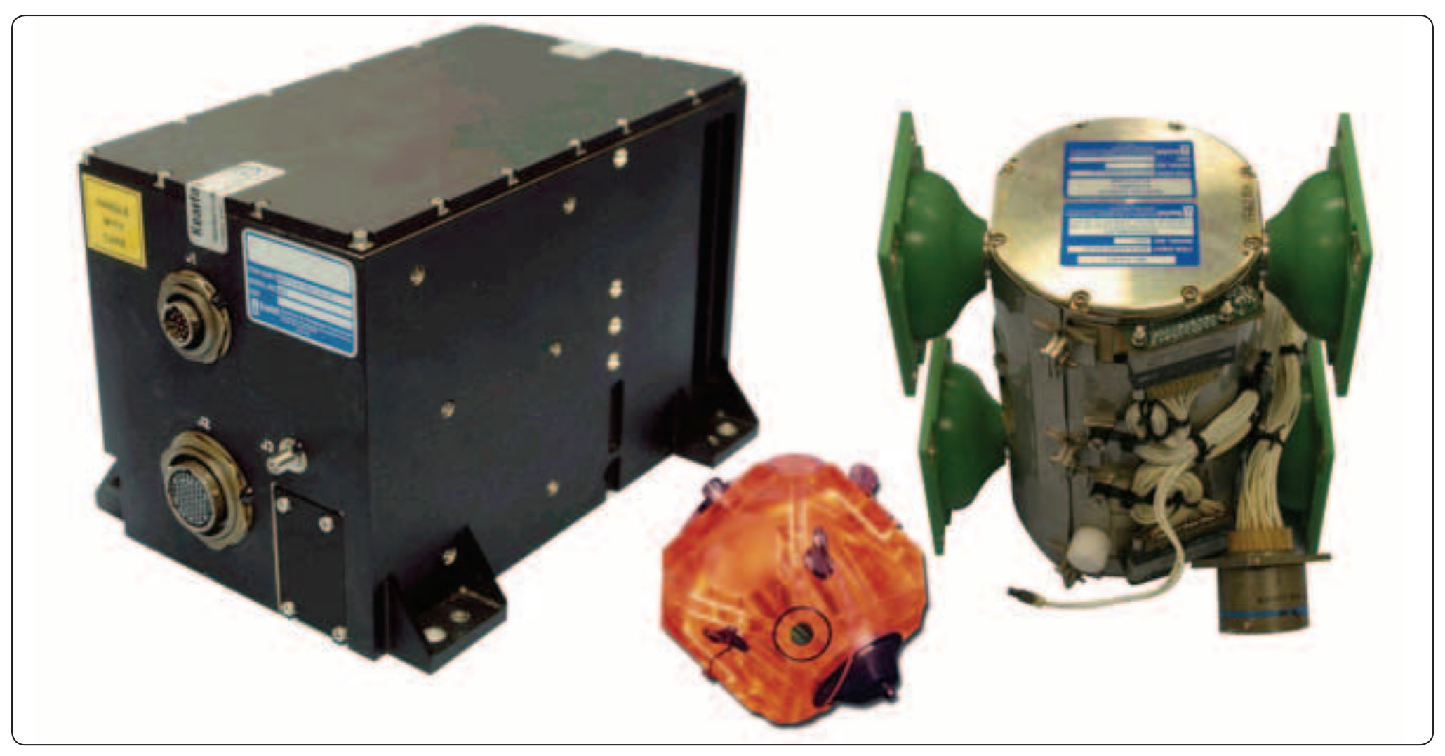 Figure 5-36. The Kearfott Attitude Heading Reference System (AHRS) on the left incorporates a Monolithic Ring Laser Gyro (MRLG) (center), which is housed in an Inertial Sensor Assembly (ISA) on the right.