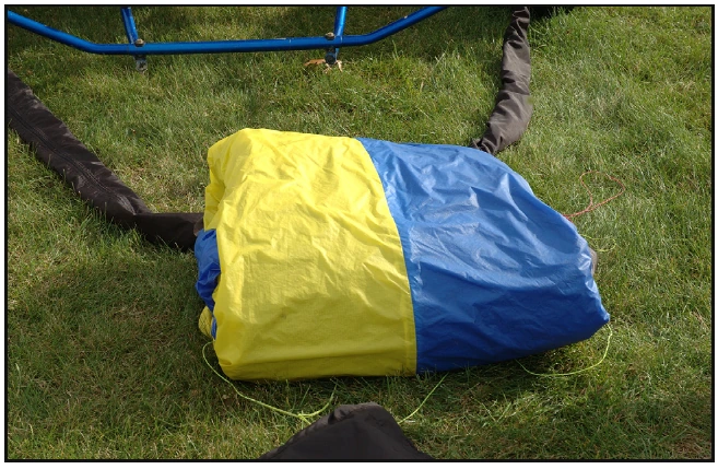 Figure 5-13. Wing removed from wing bag and folded behind the cart.
