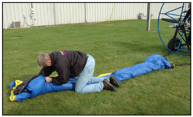 Figure 5-22. Squeeze out the air as you fold the wing for packing.