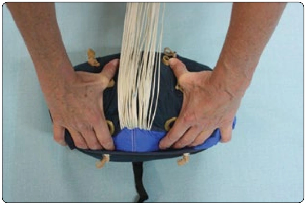 Figure 4-28. Use the flap of the bag to help control the canopy.