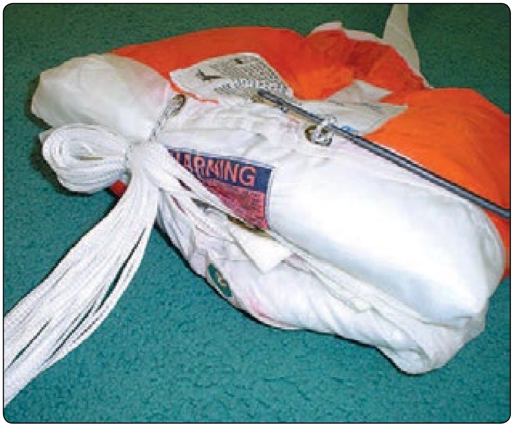 Figure 5-102. Close bag and secure locking stows.