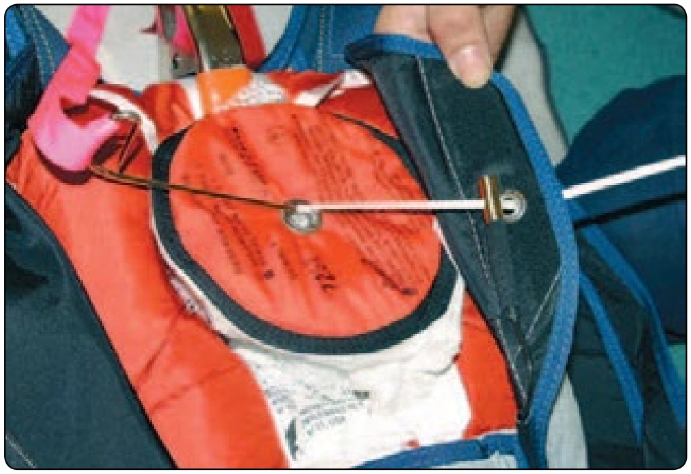 Figure 5-110. Route pull-up cord through cutter and right flap.