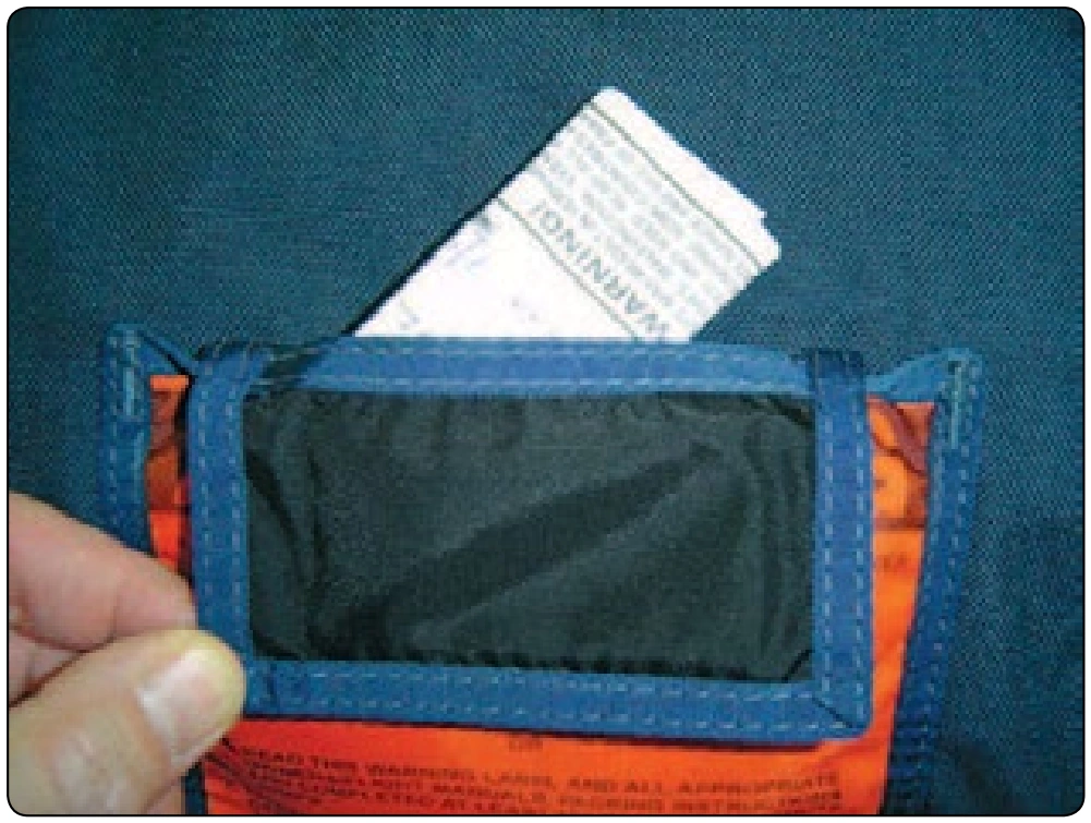 Figure 5-114. Place data card in pocket.