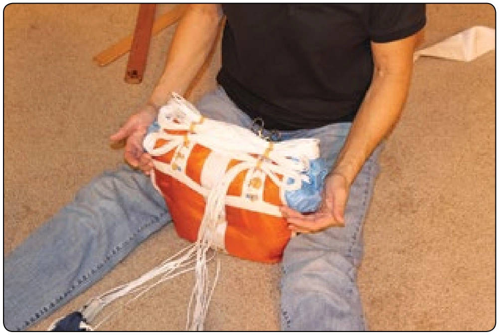 Figure 5-141. Depending on the length of the lines and the width of the bag, all of the rubber bands may or may not be used.
