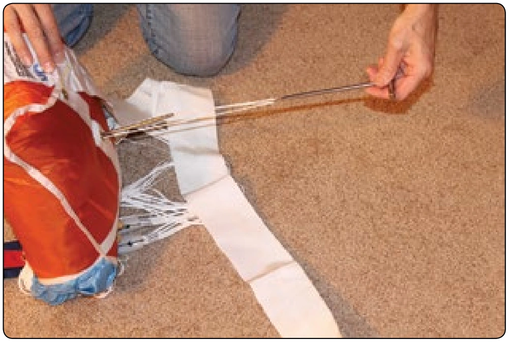 Figure 5-144. The second bodkin is now threaded through the bag in the opposite direction.