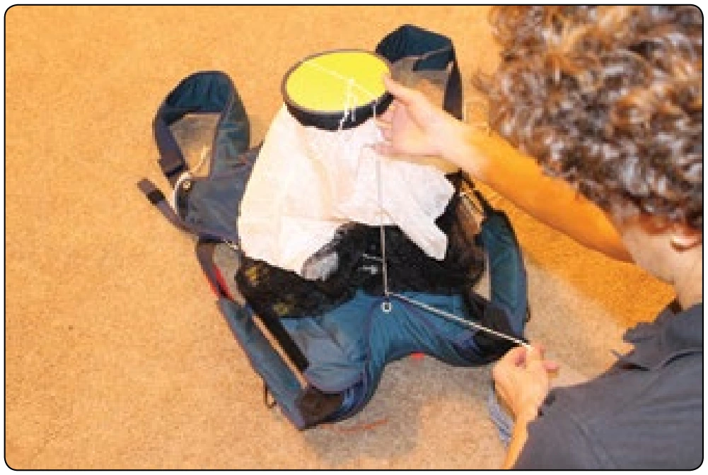 Figure 5-157. Thread pull-up cords through each closing loop and through bodkin eyes.