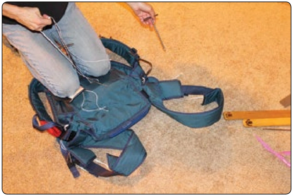 Figure 5-160. Pull the bodkins with their respective pull up cords through the pack.
