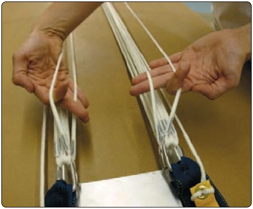 Figure 5-9. Round canopy—four-line check at four-link system.