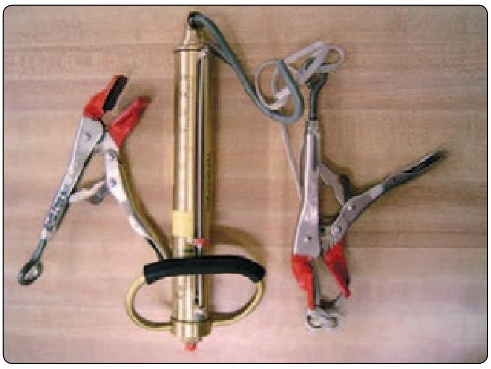 Figure 6-48. Spring scale and fabric testing clamps.