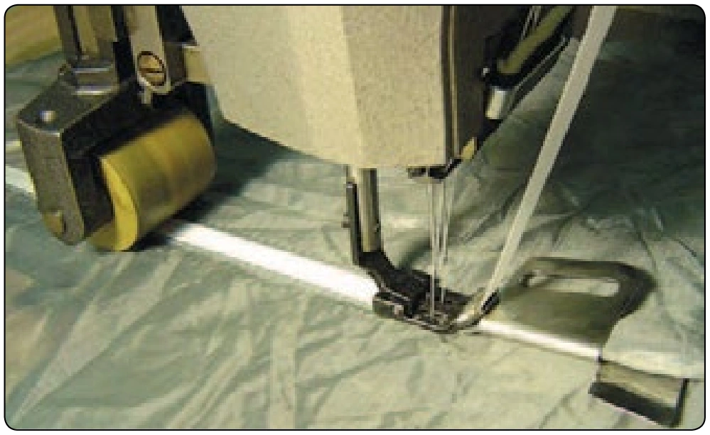 Figure 6-85. Tape feeder and French seam folder.
