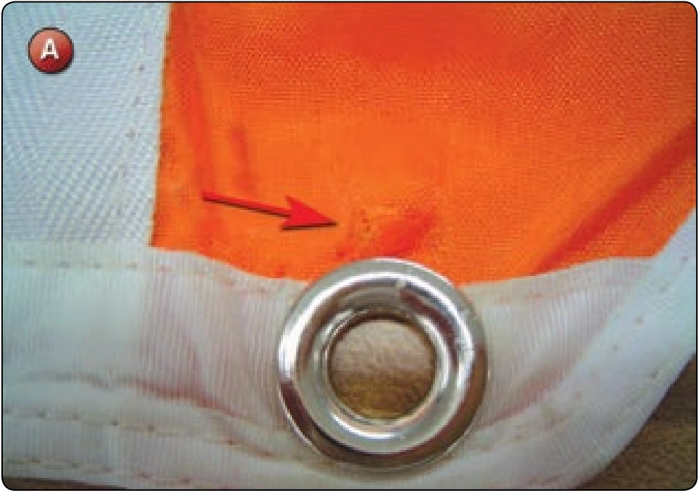 Reserve Free Bag Repair—Grommet Pullout, procedure photograph 1 (source page 7-67).