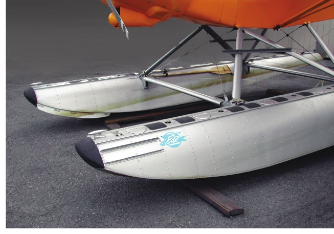 Figure 4-1. A preflight inspection with the seaplane on land provides an opportunity to thoroughly examine the floats below the waterline. Note the spray rail on the inboard chine of the far float in this photo.